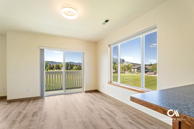 3036 Mchugh Ln, Helena, MT 59601 - unfurnished room featuring wood finished floors and a mountain view