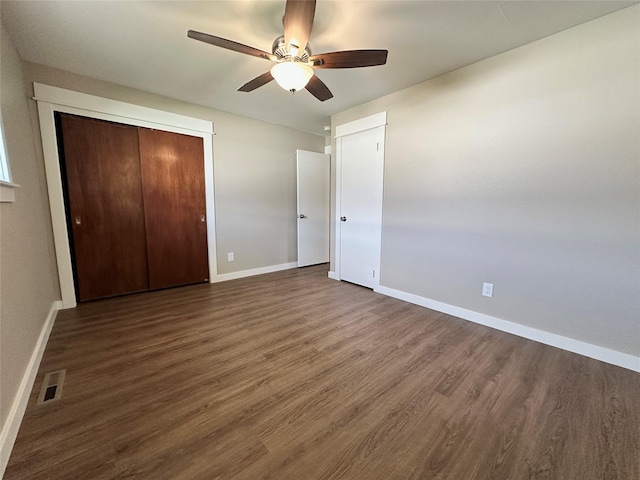 1112 Cannon St, Helena, MT 59601 - unfurnished bedroom with dark wood-type flooring, baseboards, and ceiling fan