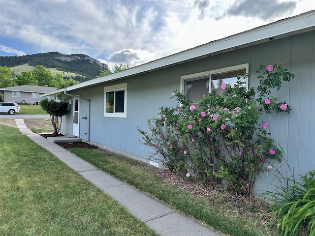 1112 Cannon St, Helena, MT 59601 - view of property exterior featuring a mountain view and a lawn