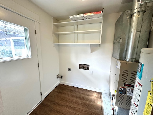 1112 Cannon St, Helena, MT 59601 - laundry room featuring hookup for an electric dryer, wood finished floors, heating unit, baseboards, and washer hookup