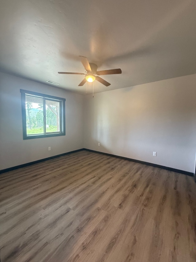 595 Grayling Rd, Lakeside, MT 59922 - unfurnished room with a ceiling fan and wood finished floors