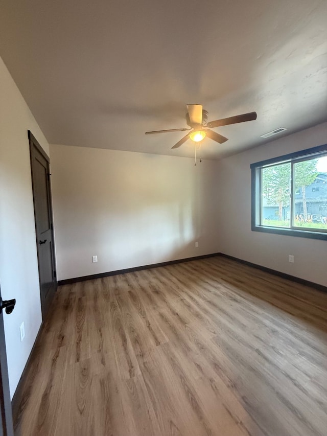 595 Grayling Rd, Lakeside, MT 59922 - unfurnished room with ceiling fan and wood finished floors