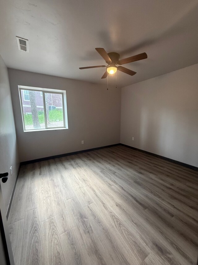 595 Grayling Rd, Lakeside, MT 59922 - unfurnished room featuring wood finished floors and ceiling fan