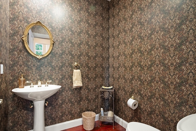 1 Reeders Village Dr, Helena, MT 59601 - bathroom with toilet, wood finished floors, baseboards, and wallpapered walls