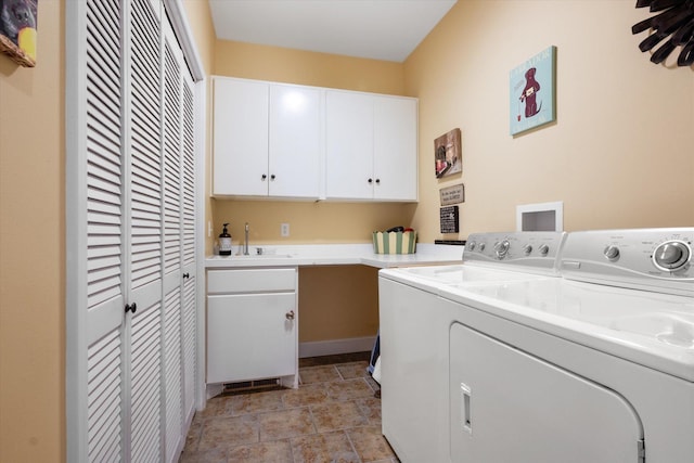 1 Reeders Village Dr, Helena, MT 59601 - laundry room with cabinet space, washer and dryer, and stone finish floors