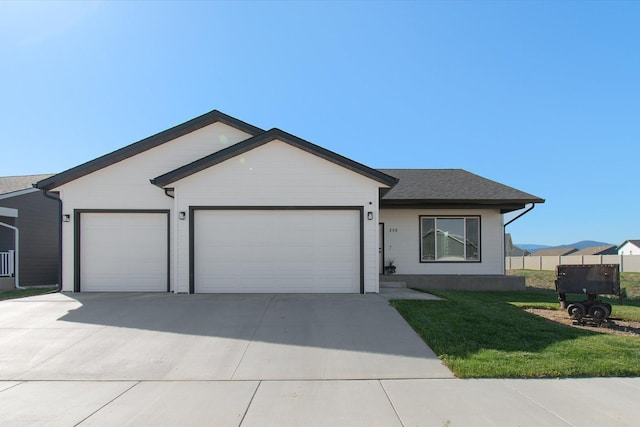 259 Meadow View Loop, East Helena, MT 59635 - ranch-style house with an attached garage, concrete driveway, and a front yard