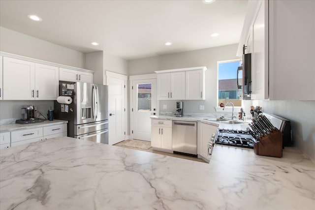 259 Meadow View Loop, East Helena, MT 59635 - kitchen featuring stainless steel appliances, a sink, white cabinetry, healthy amount of natural light, and recessed lighting