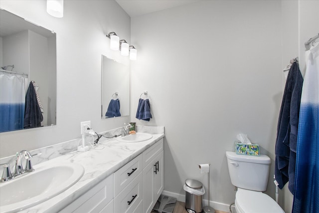 259 Meadow View Loop, East Helena, MT 59635 - bathroom with double vanity, toilet, baseboards, and a shower with curtain