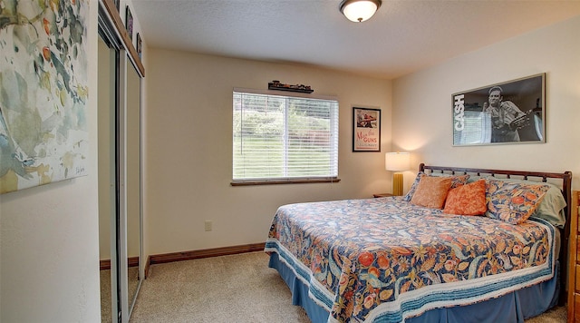 122 Bernie Rd, Alberton, MT 59820 - bedroom with carpet flooring, a closet, and baseboards