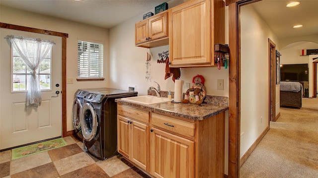 122 Bernie Rd, Alberton, MT 59820 - washroom featuring washing machine and dryer, cabinet space, recessed lighting, arched walkways, and baseboards