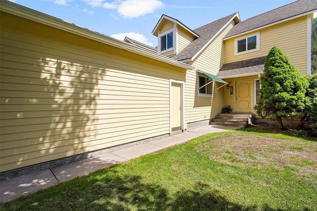 1861 E Broadway St, Missoula, MT 59802 - property entrance featuring a yard and a shingled roof