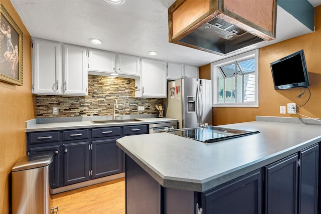 1861 E Broadway St, Missoula, MT 59802 - kitchen featuring a sink, stainless steel fridge with ice dispenser, white cabinets, backsplash, and custom range hood