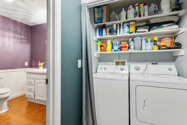 1861 E Broadway St, Missoula, MT 59802 - laundry area featuring independent washer and dryer, light wood-style flooring, and baseboards