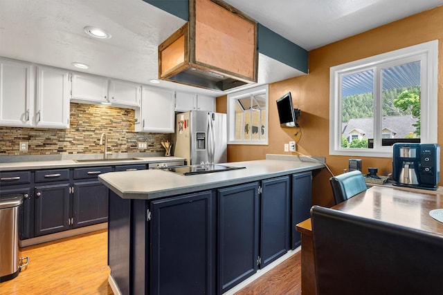 1861 E Broadway St, Missoula, MT 59802 - kitchen with a sink, stainless steel fridge with ice dispenser, white cabinetry, light wood-style flooring, and light countertops