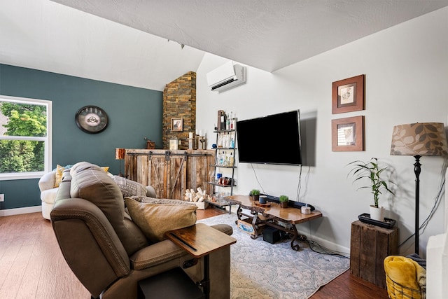 1861 E Broadway St, Missoula, MT 59802 - living room with a wall mounted AC, wood finished floors, baseboards, and lofted ceiling