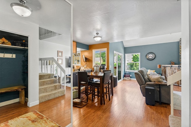 1861 E Broadway St, Missoula, MT 59802 - dining space with wood finished floors, stairs, and baseboards