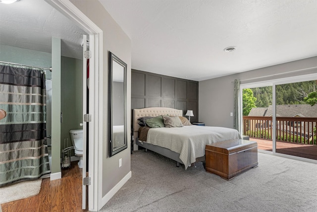1861 E Broadway St, Missoula, MT 59802 - bedroom with access to exterior, wood finished floors, and baseboards