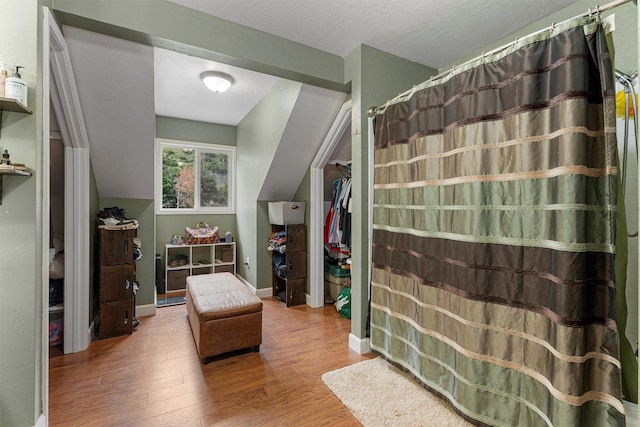 1861 E Broadway St, Missoula, MT 59802 - full bath featuring wood finished floors and curtained shower