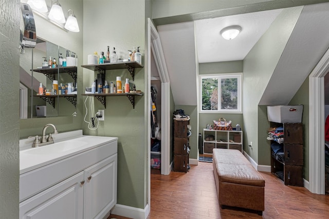 1861 E Broadway St, Missoula, MT 59802 - washroom with wood finished floors, baseboards, and bar area