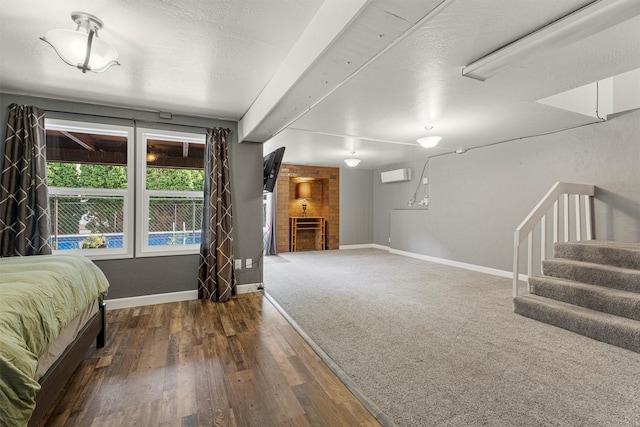 1861 E Broadway St, Missoula, MT 59802 - bedroom with a wall unit AC, wood finished floors, and baseboards