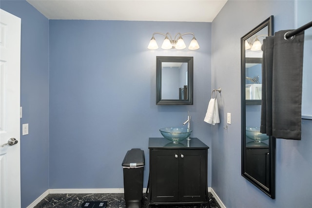 3717 Aster St, East Helena, MT 59635 - bathroom with baseboards, vanity, and marble finish flooring