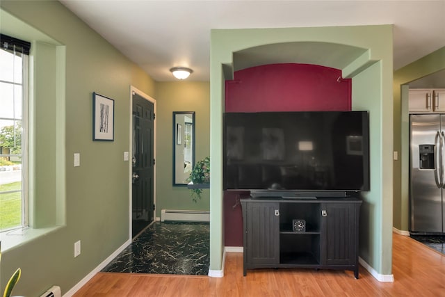 3717 Aster St, East Helena, MT 59635 - entrance foyer with a baseboard heating unit, baseboards, and wood finished floors
