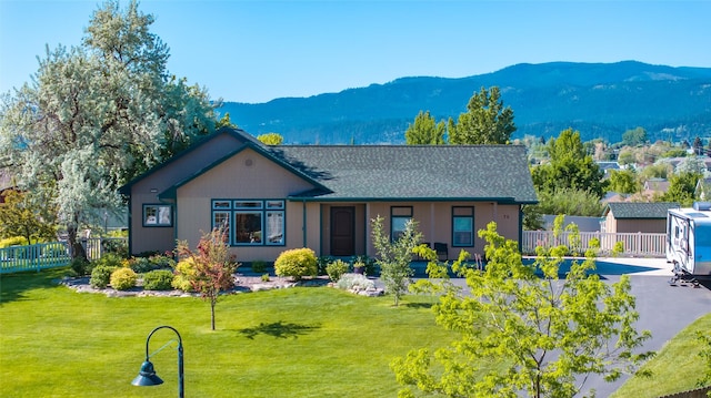 75 Windriver Dr, Kalispell, MT 59901 - view of front of house with a mountain view and roof with shingles