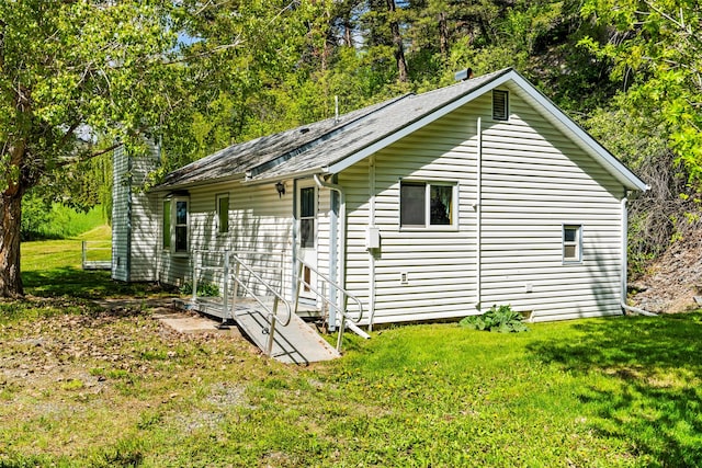 1160 US Highway 12 E, Townsend, MT 59644 - view of property exterior with a lawn, a chimney, and roof with shingles