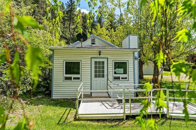 1160 US Highway 12 E, Townsend, MT 59644 - rear view of property featuring a deck and a chimney
