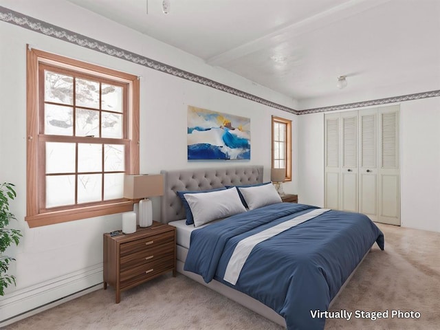 1160 US Highway 12 E, Townsend, MT 59644 - bedroom with light carpet, baseboard heating, and a closet