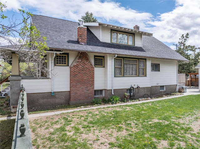 804 Broadway St, Townsend, MT 59644 - view of home's exterior featuring a chimney and a shingled roof