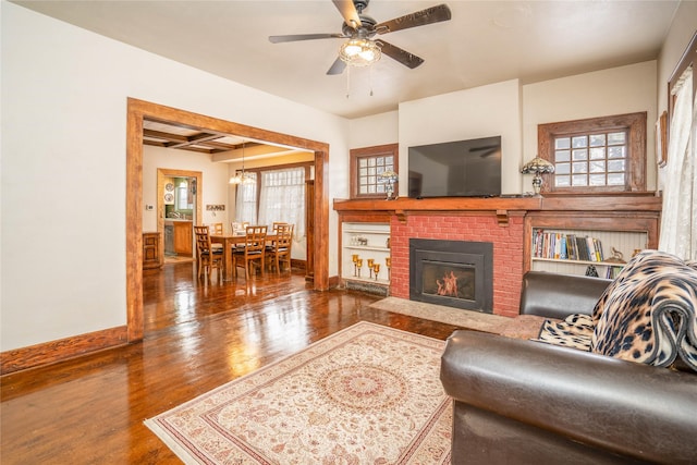804 Broadway St, Townsend, MT 59644 - living area featuring wood finished floors, ceiling fan, and a fireplace