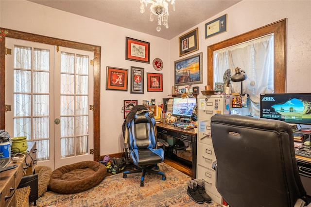 804 Broadway St, Townsend, MT 59644 - home office with healthy amount of natural light, wood finished floors, and a chandelier