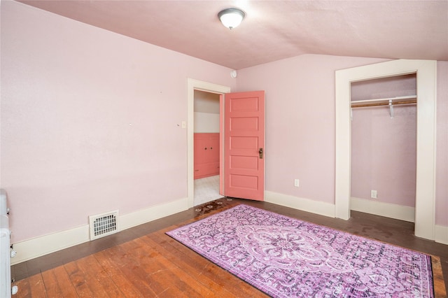 804 Broadway St, Townsend, MT 59644 - unfurnished bedroom featuring vaulted ceiling, wood finished floors, and a closet