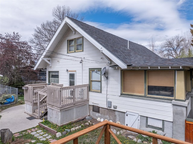 804 Broadway St, Townsend, MT 59644 - rear view of house featuring a shingled roof and a wooden deck