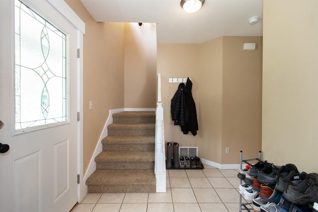 3401 Ravalli St, Bozeman, MT 59718 - entryway with healthy amount of natural light, light tile patterned flooring, stairs, and baseboards