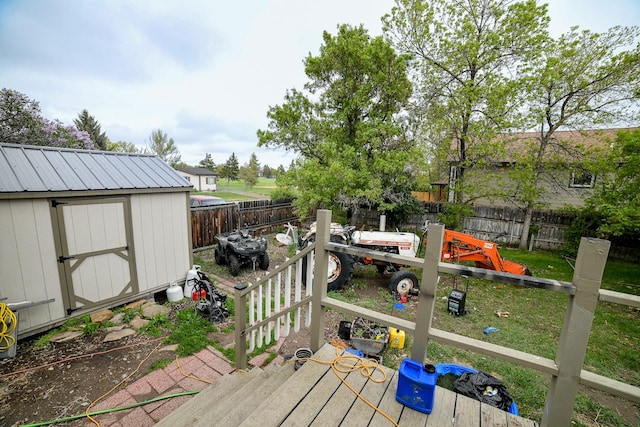 17 9th St NW, Great Falls, MT 59404 - wooden deck featuring a shed and a fenced backyard