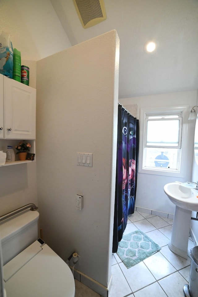 17 9th St NW, Great Falls, MT 59404 - full bath with toilet, tile patterned flooring, and a shower with shower curtain
