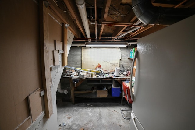 17 9th St NW, Great Falls, MT 59404 - unfinished below grade area featuring freestanding refrigerator and a workshop area