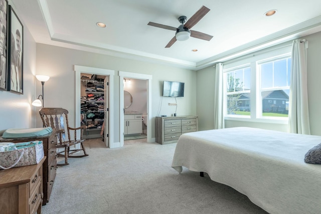 2805 Travis Ave, Helena, MT 59601 - bedroom featuring light carpet, a walk in closet, a raised ceiling, recessed lighting, and ensuite bath