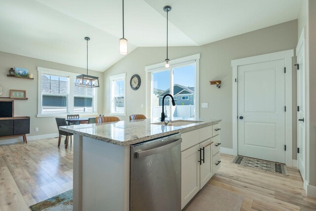 2805 Travis Ave, Helena, MT 59601 - kitchen with dishwasher, a sink, light wood-style floors, lofted ceiling, and light stone countertops