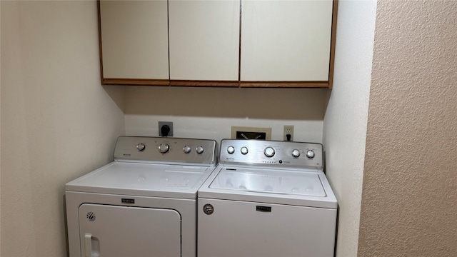 10 Pine Ridge Cir, Clancy, MT 59634 - laundry area with cabinet space, washing machine and dryer, and a textured wall