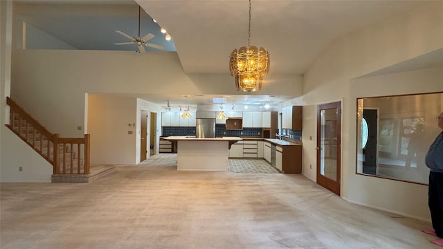 10 Pine Ridge Cir, Clancy, MT 59634 - kitchen featuring appliances with stainless steel finishes, open floor plan, a chandelier, and ceiling fan