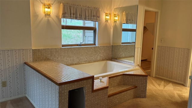 10 Pine Ridge Cir, Clancy, MT 59634 - bathroom featuring a garden tub, baseboards, wainscoting, and wallpapered walls