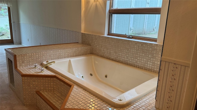 10 Pine Ridge Cir, Clancy, MT 59634 - bathroom with wainscoting and a jetted tub