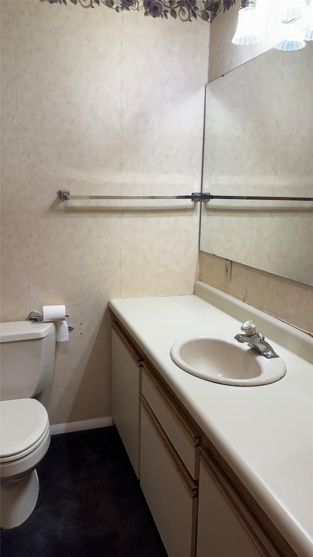 10 Pine Ridge Cir, Clancy, MT 59634 - bathroom featuring vanity, toilet, and baseboards