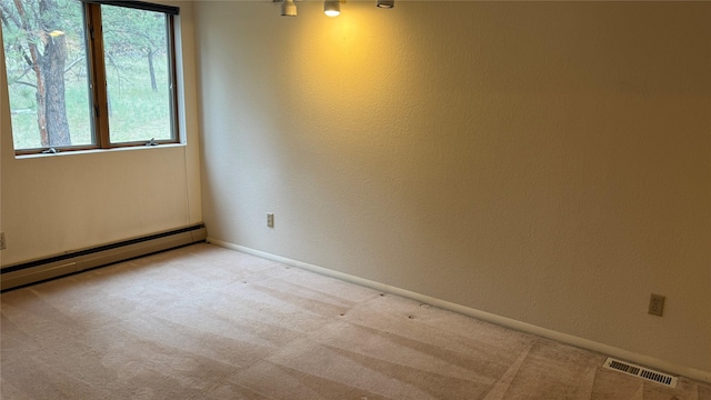 10 Pine Ridge Cir, Clancy, MT 59634 - unfurnished room with a baseboard heating unit and carpet