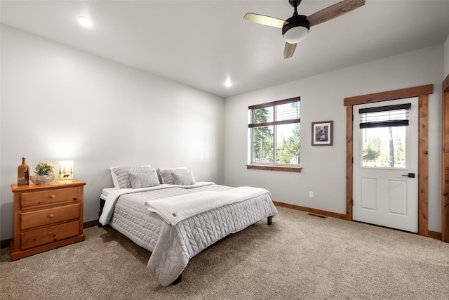 165 Lynx Ct, Seeley Lake, MT 59868 - bedroom with baseboards, carpet, and a ceiling fan