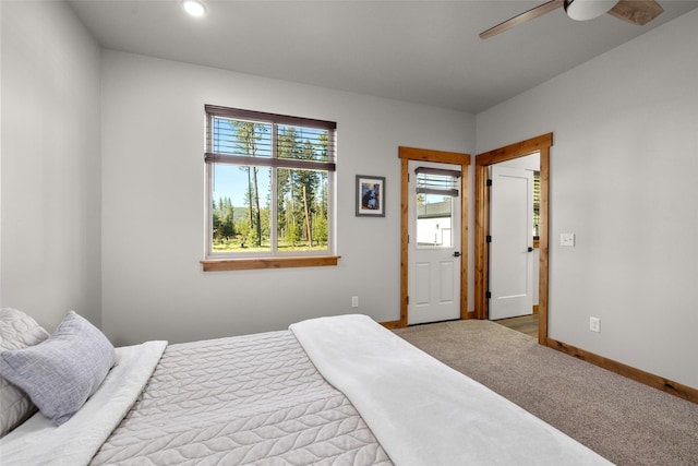 165 Lynx Ct, Seeley Lake, MT 59868 - bedroom featuring multiple windows, baseboards, carpet, and ceiling fan