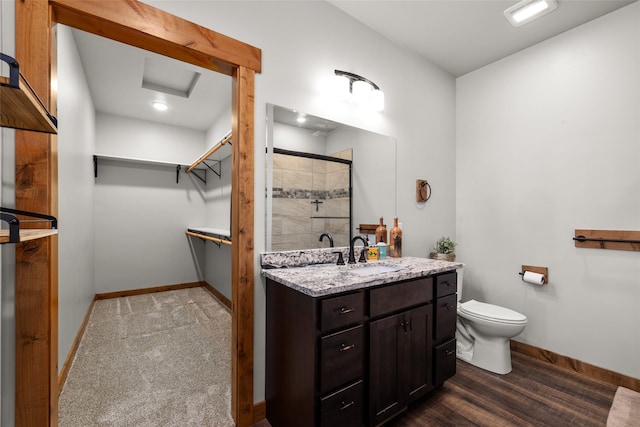 165 Lynx Ct, Seeley Lake, MT 59868 - bathroom featuring vanity, a stall shower, toilet, and baseboards